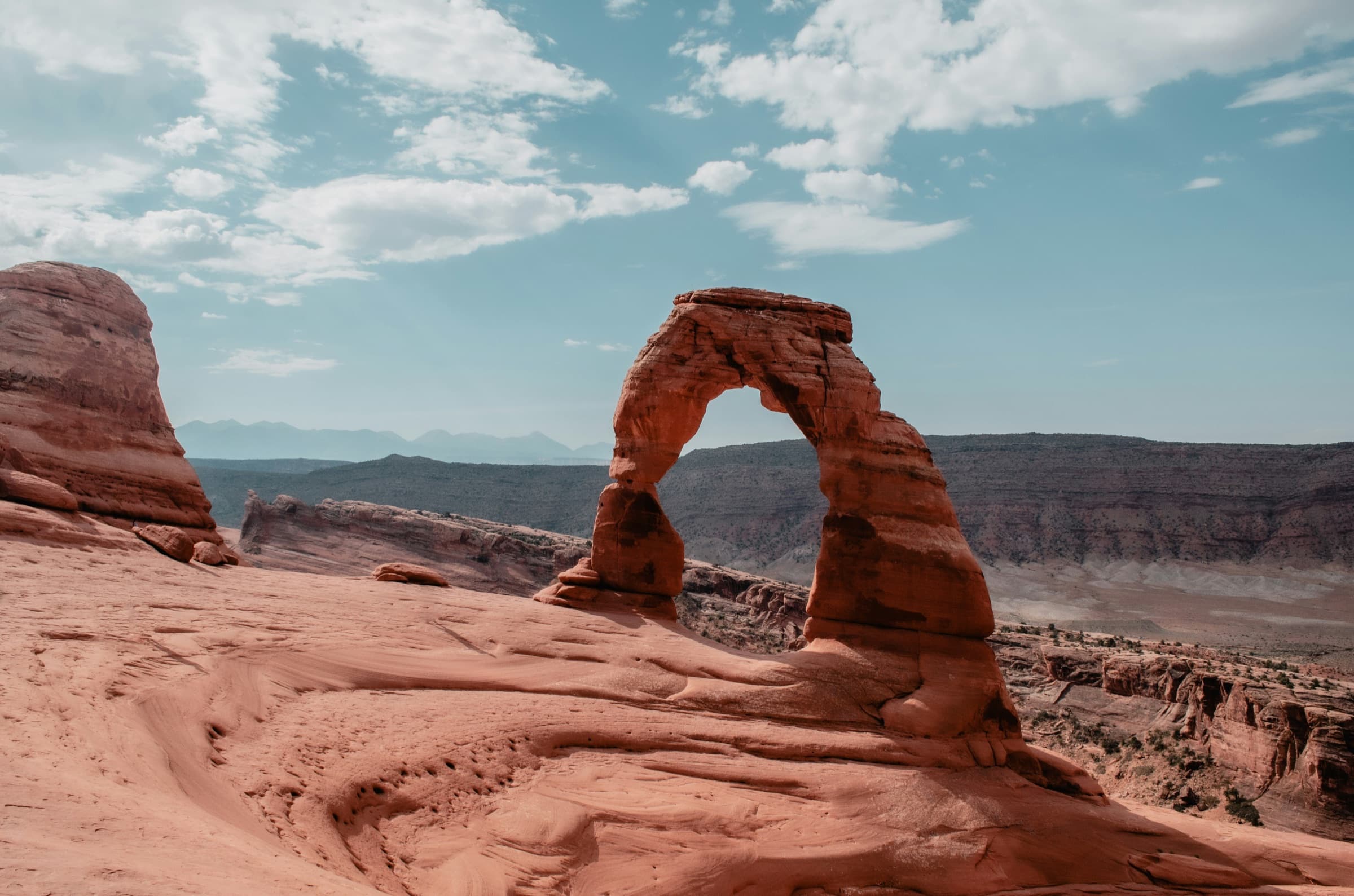 Delicate Arch above the Moab desert under a wide sky